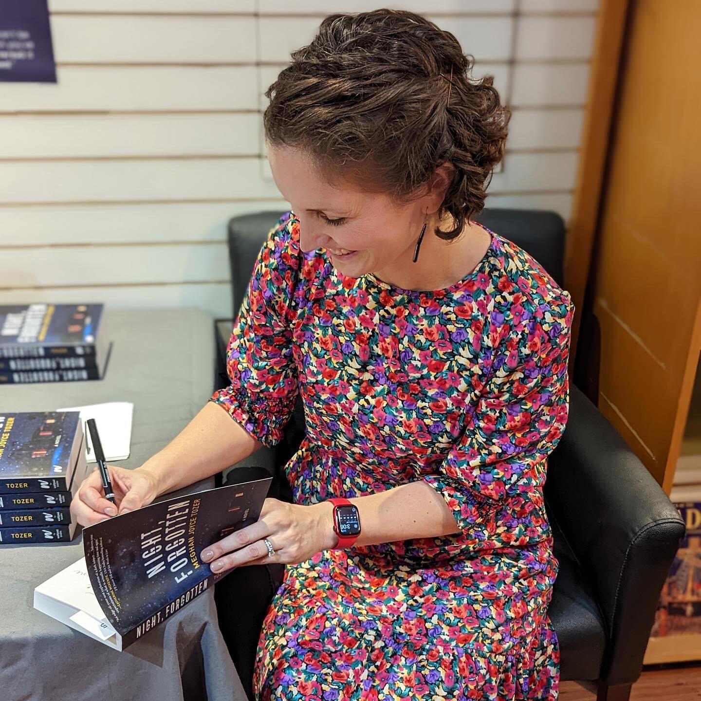 Meghan Joyce Tozer signs copies of NIGHT, FORGOTTEN at the book launch.